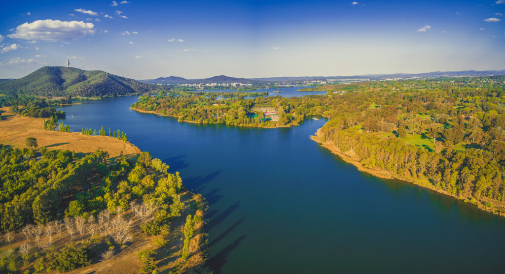 Large river flowing through a landscape with tress